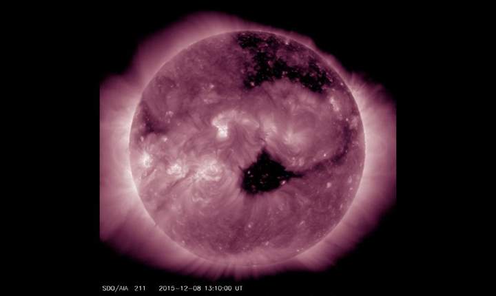 A coronal hole (seen at centre) is stream solar particles towards Earth.