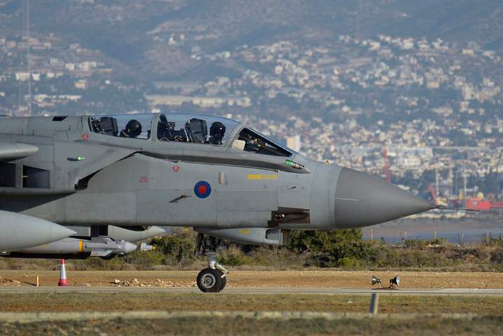 A British tornado warplane passes on the runway at the RAF Akrotiri, a British air base near coastal city of Limassol, Cyprus, Thursday, Dec. 3, 2015 after an airstrike. U.S. and coalition airstrikes killed 10 Islamic State leaders over the past month, including several linked to the Paris attacks or other plots against the West, a U.S. military official in Iraq said Tuesday. 
