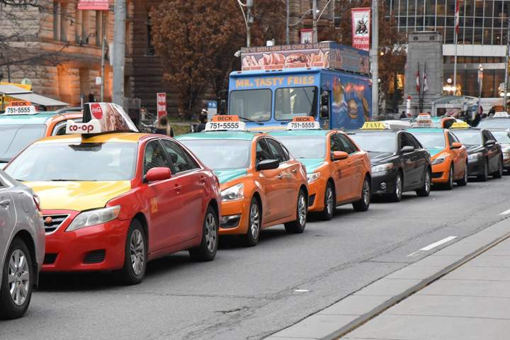 Toronto taxi drivers brought city traffic to a standstill in a massive anti-Uber protest on December 9.