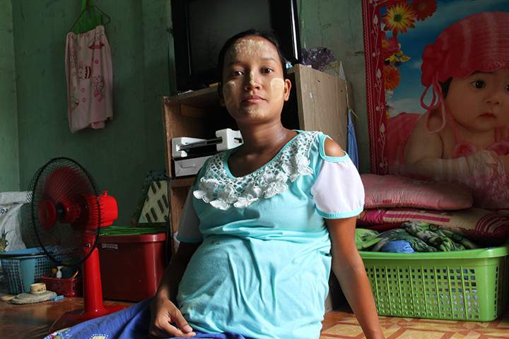 This Aug. 31, 2015 photo shows Win Win Than, 25, who worked in a shrimp shed in Samut Sakhon, Thailand to pay off her US $550 debt even when she was pregnant. She said she tried to run away but was caught and handcuffed in a small room inside the shed.