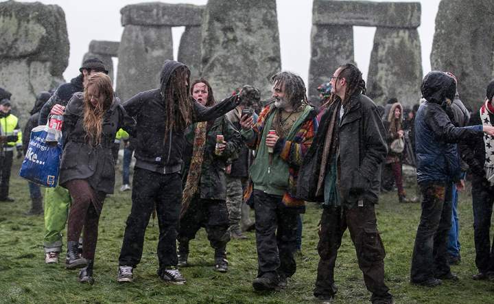 Rain falls as druids, pagans and revellers gather at Stonehenge, hoping to see the sun rise, as they take part in a winter solstice ceremony at Stonehenge on December 21, 2013 in Wiltshire, England.