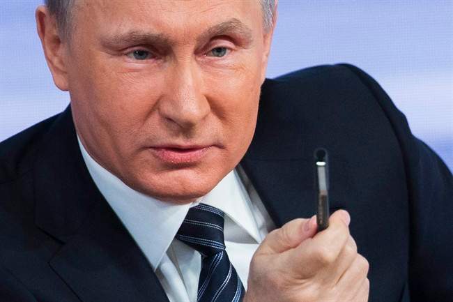 Russian President Vladimir Putin speaks during his annual news conference in Moscow, Russia, Thursday, Dec. 17, 2015. 