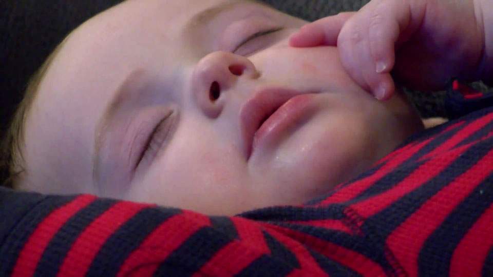 Shh! Baby and Santa take a nap during photo, picture goes viral - image