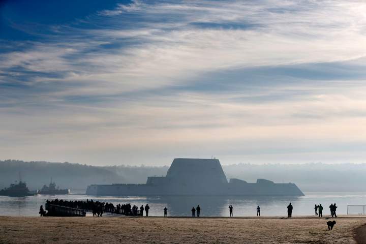The first Zumwalt-class destroyer, the largest ever built for the U.S. Navy, heads down the Kennebec River after leaving Bath Iron Works, Monday, Dec. 7, 2015, in Bath, Maine. The ship is headed out to sea for the first time to undergo sea trials.