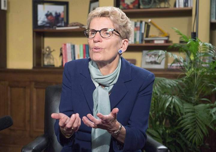 Ontario Premier Kathleen Wynne gestures during an interview with The Canadian Press in Toronto on Friday October 23, 2015. Wynne says Ontario is preparing legislation on doctor-assisted death in case the Supreme Court of Canada rejects a federal government request for a six-month extension to develop new rules. 