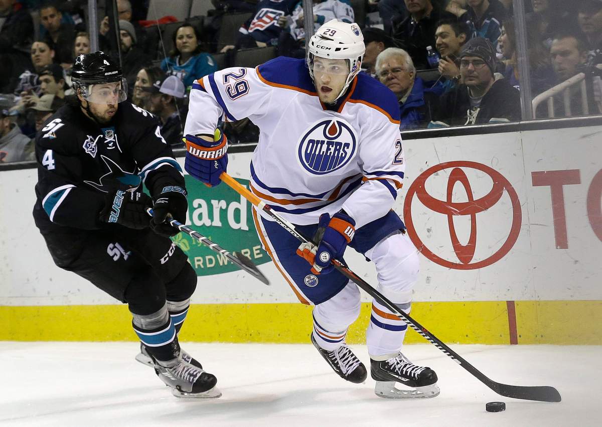 Edmonton Oilers center Leon Draisaitl (29), from Germany, skates past San Jose Sharks defenseman Brenden Dillon (4) during the second period of an NHL hockey game in San Jose, Calif., Thursday, Jan. 14, 2016. 