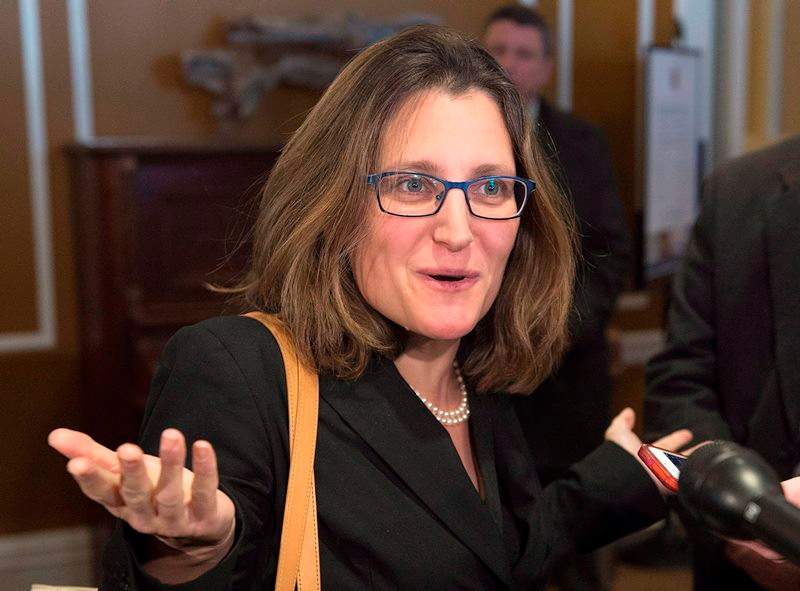 International Trade Minister Chrystia Freeland talks with reporters after the morning session at a cabinet retreat at the Algonquin Resort in St. Andrews, N.B. on Monday, Jan. 18, 2016. 