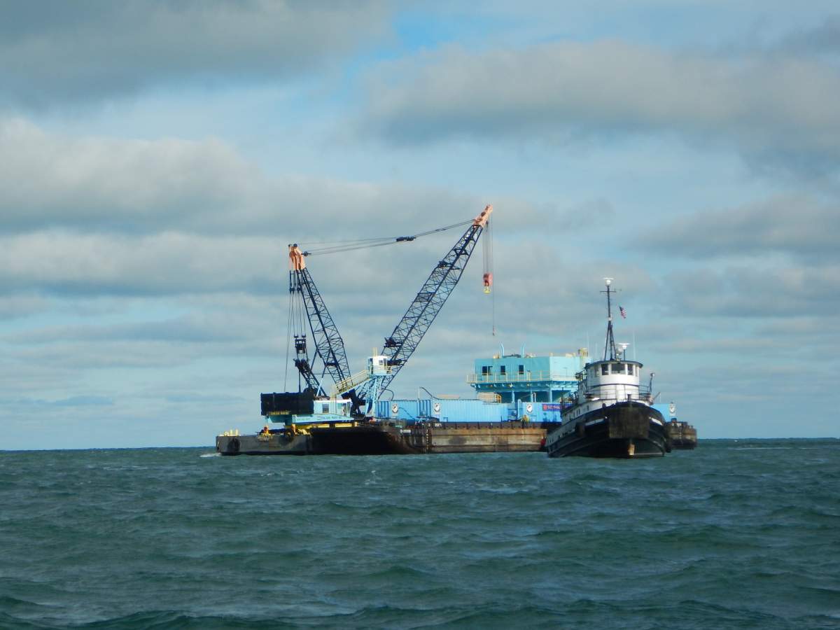 Crews continue operations for the Lake Erie sunken tanker barge Argo as Unified Command responders took advantage of a favorable weather window, Nov. 29, 2015. As weather allows, responders continued salvage operations hot-tapping and pumping the barges tanks.