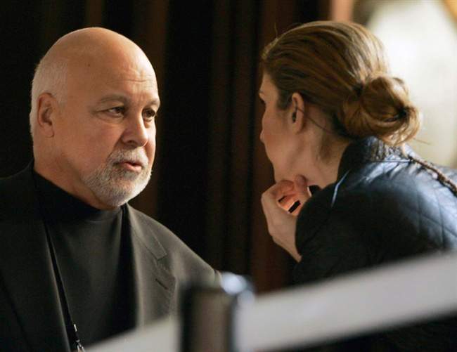Celine Dion talks with her husband René Angélil during a break in her rehearsal at the Kodak Theatre Friday, Feb. 23, 2007, in Los Angeles.