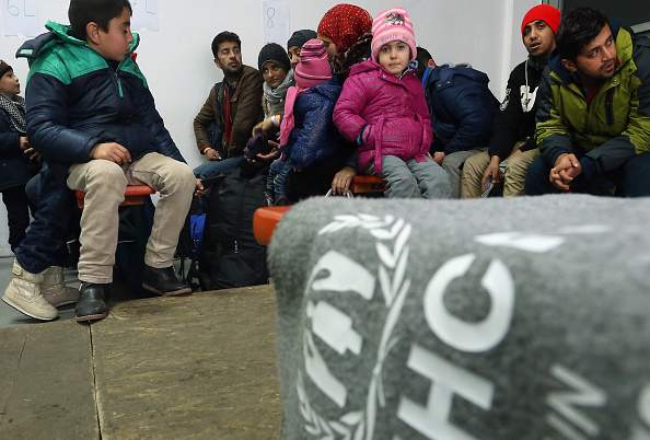 German police search migrants and refugees arriving from Austria at a processing center on January 27, 2016 in Passau, Germany. The flow of migrants arriving in Passau has dropped to between 500 and 1,000 per day, down significantly from last November, when in the same region up to 6,000 migrants were arriving daily. German police only allows migrants to enter who say they will apply for asylum in Germany. Those who say they want to continue to other countries, such as Denmark or Sweden, are denied entry and brought back to Austria.
