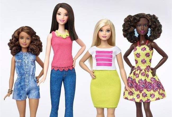 This photo provided by Mattel shows a group of new Barbie dolls introduced in January 2016.