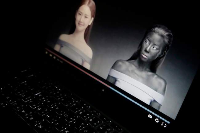 An online advertisement by Thai cosmetics company Seoul Secret showing Thai actress Cris Horwang, right, is displayed on a computer screen in Bangkok, Thailand, Friday, Jan. 8, 2016.