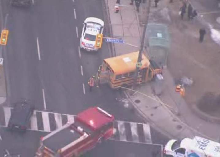 Emergency crews attend to the scene of a school bus crash in east-end Toronto on Jan. 28, 2016.