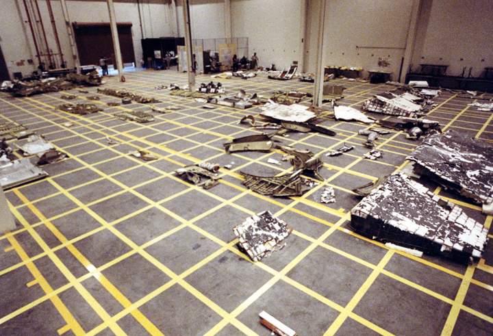 Pieces of the Space Shuttle Challenger are arranged in a hangar after being salvaged from the Atlantic Ocean where they were scattered, on January 28, 1986 when the spacecraft exploded.