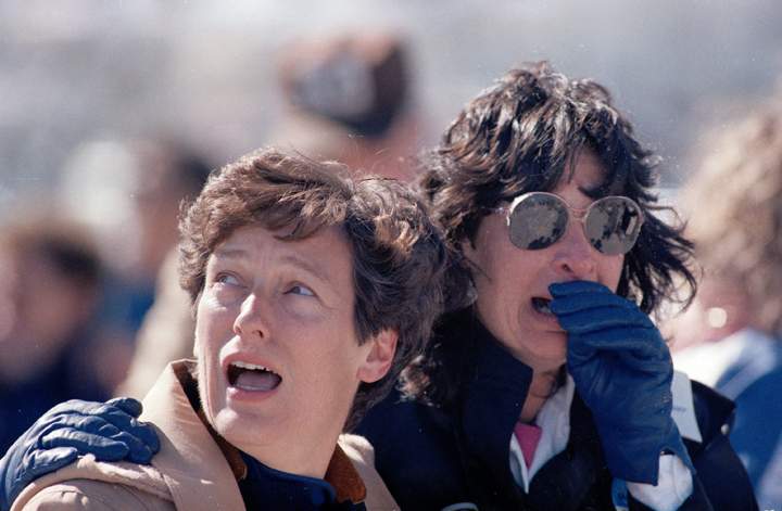 Two spectators at the Kennedy Space Center in Cape Canaveral, Florida, react after witnessing the loss of the space shuttle Challenger on Jan. 28, 1986.