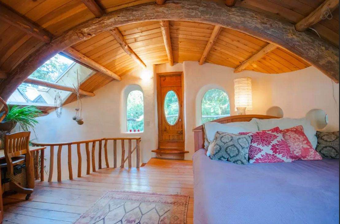 This "unique cob cottage" on Mayne Island in B.C. is "a welcoming and cozy retreat hand sculpted of local, sustainable natural materials located on a lovely acreage with sheep, gardens and orchards.".