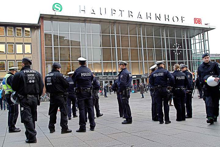 Police officers patrol in front of the main station of Cologne, Germany, on Wednesday, Jan. 6, 2016. 