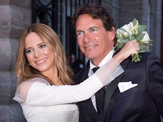 Parti Québécois leader Pierre Karl Péladeau and TV host Julie Snyder hug after getting married in Quebec City on August 15, 2015.