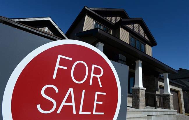 A sign advertises a new home for sale in Carleton Place, Ont., on March 17, 2015.