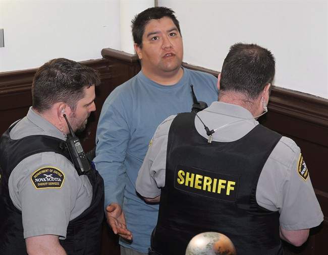 Andre Noel Denny arrives at Nova Scotia Provincial court in Halifax on Apr.18, 2012 to be arraigned on charges stemming from the beating death of gay activist Raymond Taavel. 