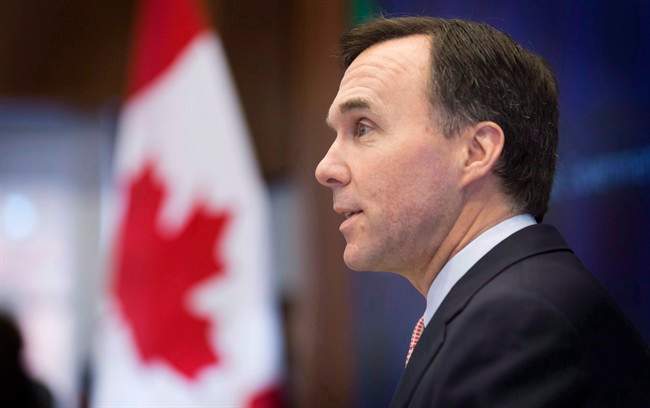 Finance Minister Bill Morneau speaks at the Munk School of Global Affairs in Toronto on Wednesday, January 13, 2016. THE CANADIAN PRESS/Peter Power.