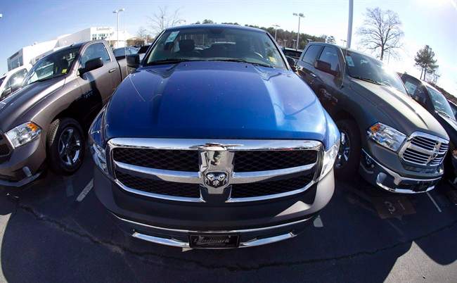 Ram pickup trucks are on display on the lot at Landmark Dodge Chrysler Jeep RAM in Morrow, Ga., on Jan. 5, 2015. Fiat Chrysler Canada, one of the biggest car manufacturers in the country, says it saw its annual sales rise 1.1 per cent in 2015 in what is expected to be a record year for Canadian auto sales. 
