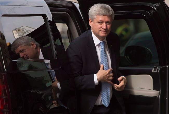 Outgoing Prime Minister Stephen Harper arrives at his Langevin office in Ottawa, Wednesday Oct. 21, 2015.