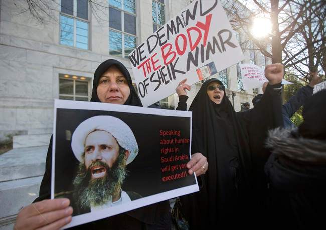 Amel Al-Hajjar, left, and Khadija Falih, both from Iraq, participate in a rally in front of the Saudi Arabian embassy in Washington, Tuesday, Jan. 5, 2016, to protest the mass executions in Saudi Arabia. Saudi Arabia executed last Saturday, Shiite cleric Sheikh Nimr al-Nimr and 46 others convicted of terror charges, the largest mass execution carried out by the kingdom since 1980. 