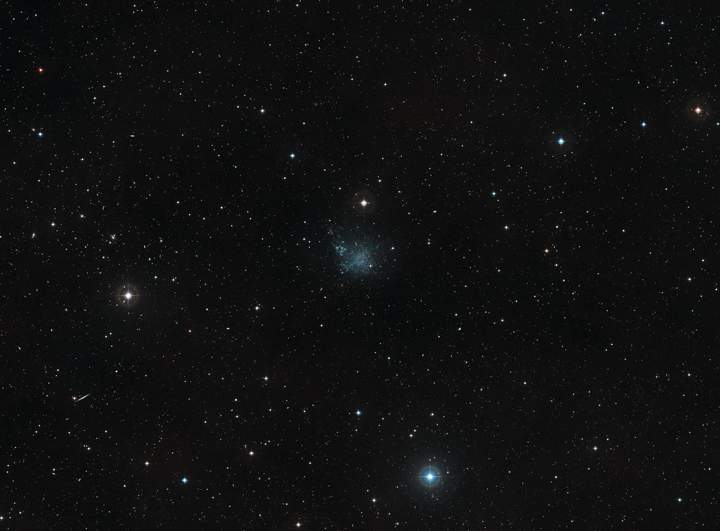 This wide-field view shows the sky around the dwarf galaxy IC 1613 in the constellation of Cetus.