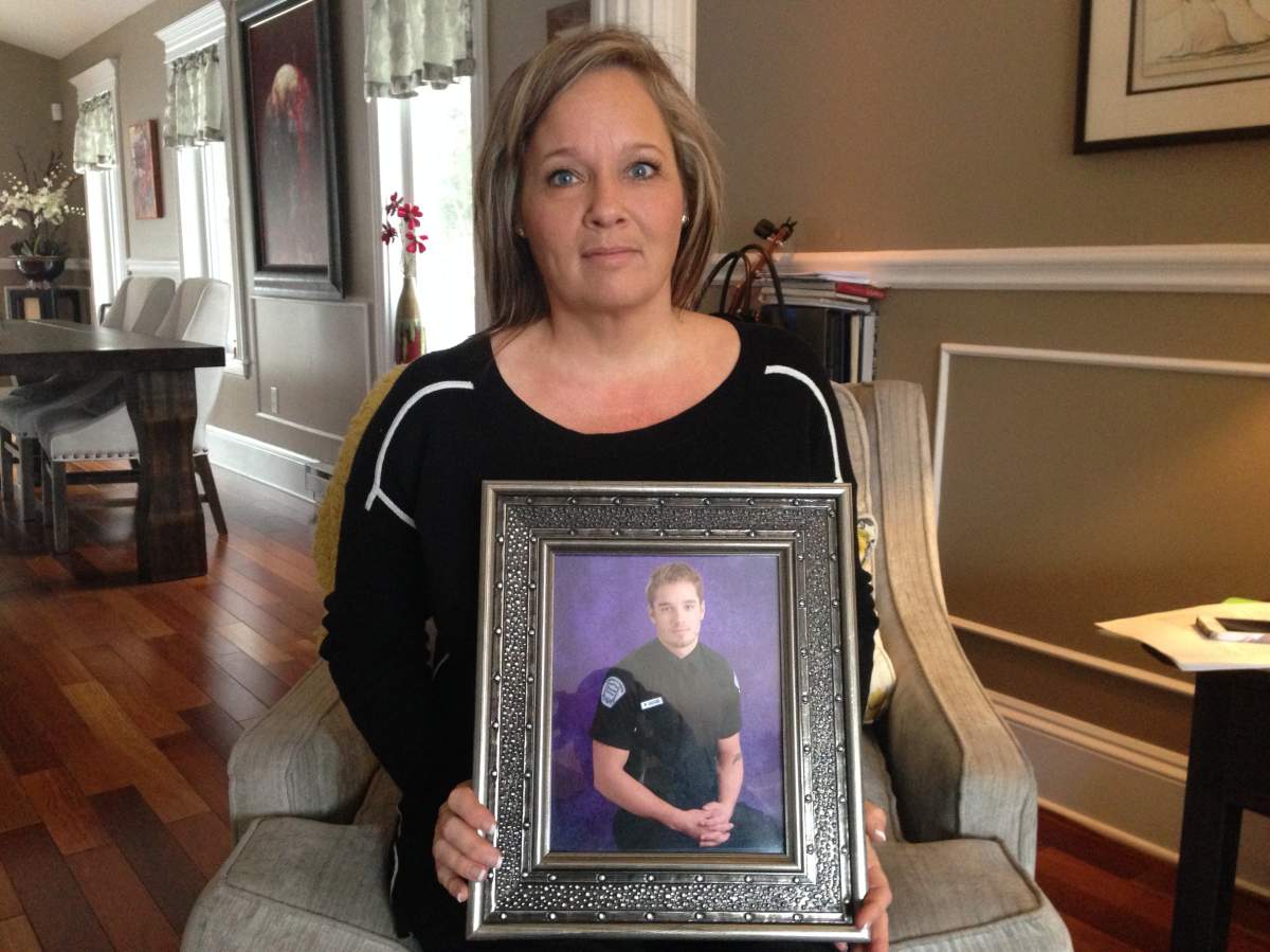 Trine Lise-Good holds up a picture of her son Ryan Good who died on an overdose in 2012.