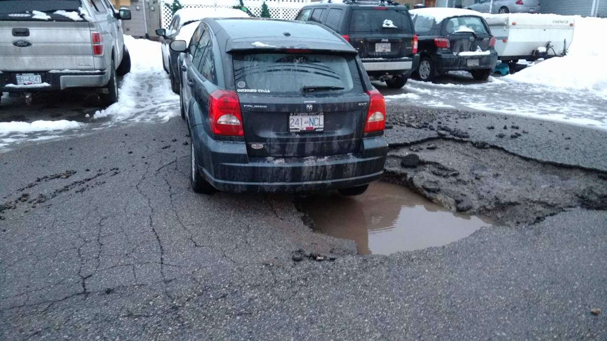 Sinkhole caused by broken water line almost swallows West Kelowna car - image