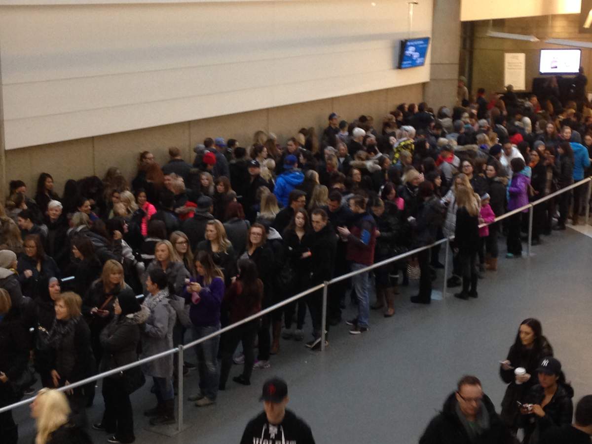 Hundreds of people waiting in line at the lululemon warehouse sale in Edmonton, Alta. Friday, January 15, 2016.