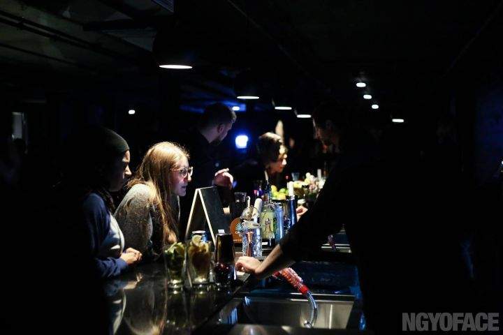 People having drinks at the Chvrch of John at a popup event on Dec. 23, 2015.