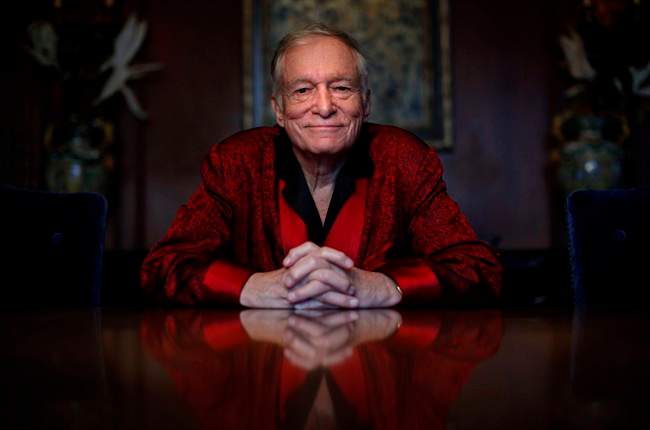  In this Nov. 4, 2010, file photo, Playboy magazine founder Hugh Hefner poses for photos at the Playboy Mansion in Los Angeles.