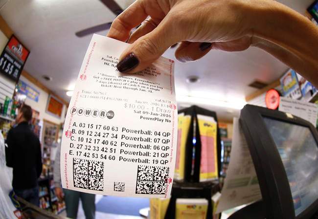 In this photo  a clerk hands a patron Cranberry Township, Pa. 