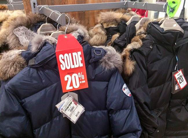 Winter jackets on sale are seen in a Montreal store. 
