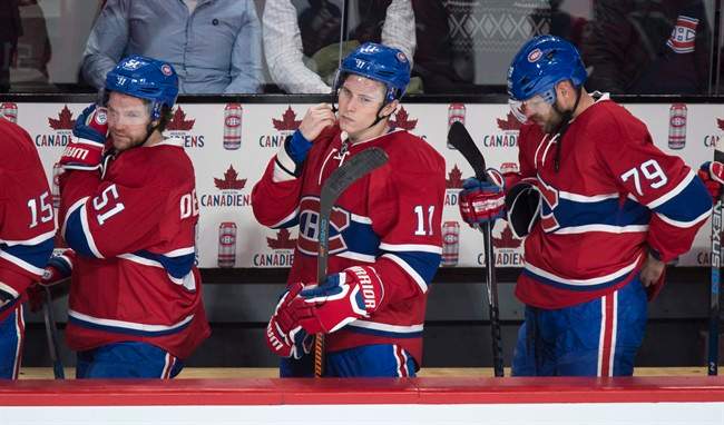 Montreal Canadiens’ David Desharnais, left to right, Brendan Gallagher and Andrei Markov leave the bench following their 5-2 loss to the Columbus Blue Jackets after NHL hockey action, in Montreal on Tuesday, Jan. 26, 2016.