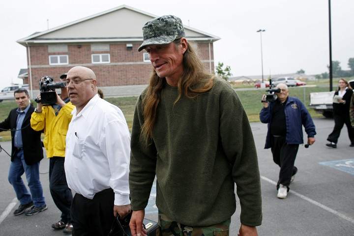Mohawk Shawn Brant walks with lawyer, Peter Rosenthal, into the Napanee Detachment of the Ontario Provincial Police, to turn himself in on Thursday, July 5, 2007.