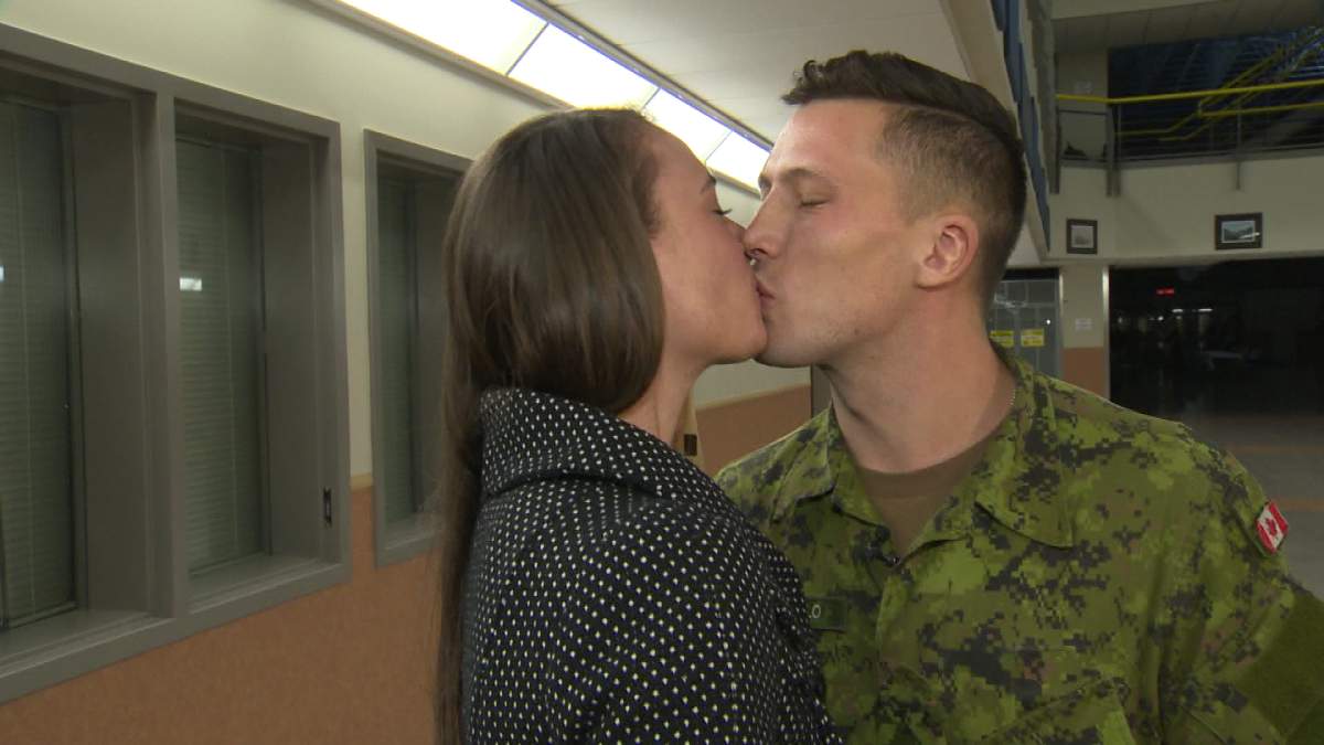 Private Chris Chabaylo and his new fiancee Courtney Halfpenny kiss after getting engaged.