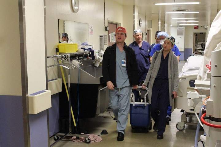 Surgeons arrive at Toronto Western Hospital’s Operating Rooms with the limb that will be surgically attached to the patient.