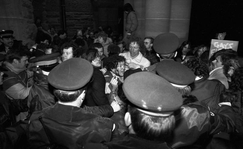 A man with blood streaming down his face scuffles with police outside the Ontario Legislature in Toronto on Feb. 6, 1981 after about 1000 gay rights demonstrators marched there in protest of the arrests on Feb. 5, 1981 of 253 men in four city steam baths. 