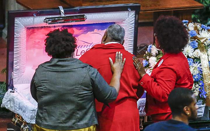 Mary Stenger the foster mother of Quintonio LeGrier views his body during his funeral service at New Mount Pilgrim Missionary Baptist Church in Chicago, Illinois on January 9, 2016. 
