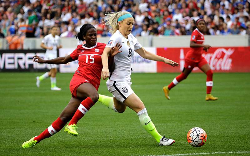 United States’ Julie Johnston keeps Canada's Nichelle Prince from the ball during the first half of the CONCACAF Olympic women's soccer qualifying championship final Sunday, Feb. 21, 2016, in Houston. 
