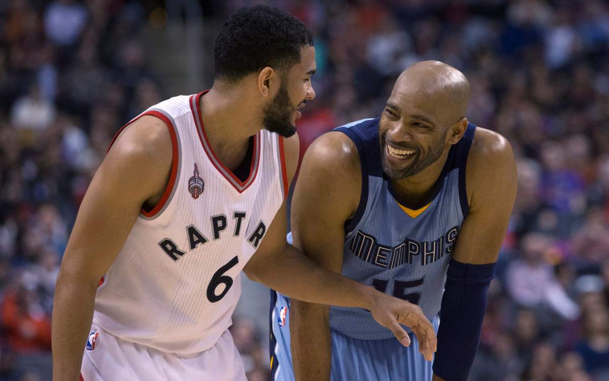 Toronto Raptors' Cory Joseph shares a joke with Memphis Grizzlies' Vince Carter during second half NBA basketball action in Toronto on Sunday, February 21, 2016. 