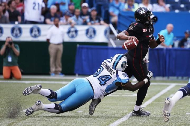 Euclid Cummings sacks Ottawa RedBlacks quarterback Henry Burris during the 2nd half of the Toronto Argonauts 30-24 win at Rogers Centre on August 23, 2015.