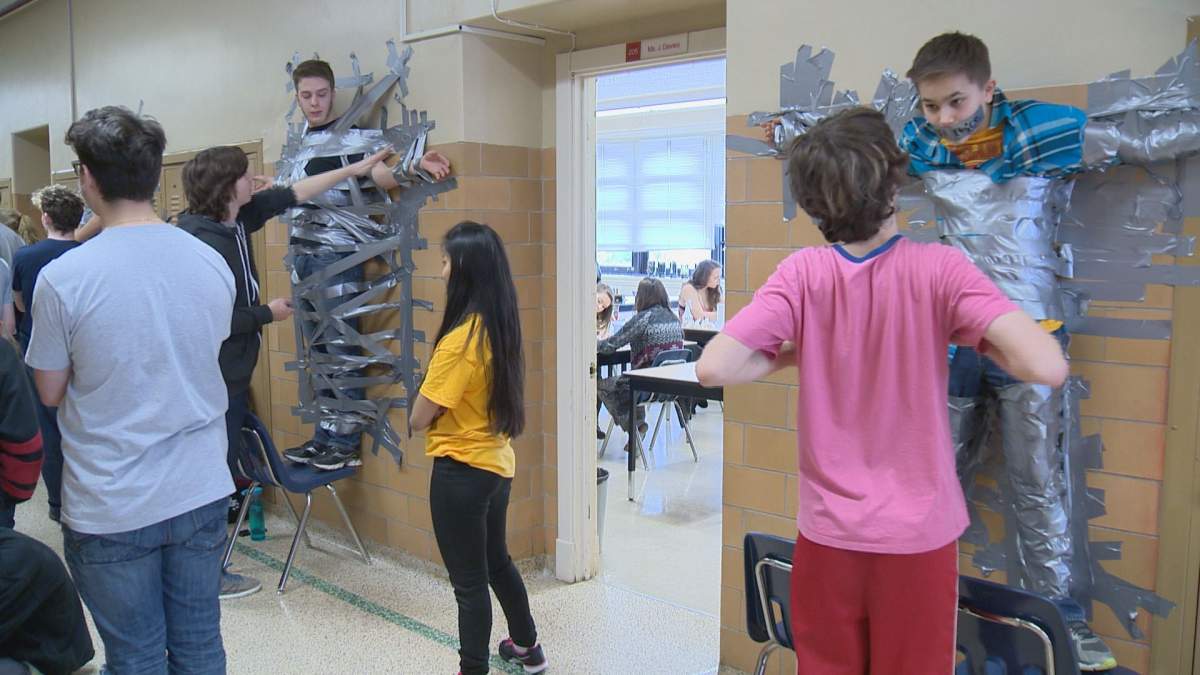 Students compete in duct tape challenge in effort to stay awake.
