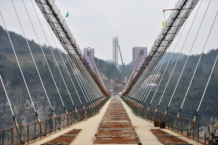General view of a suspension bridge, about 300 metres above ground, at The Grand Canyon of Zhangjiajie on January 27, 2016 in Zhangjiajie, Hunan Province of China.