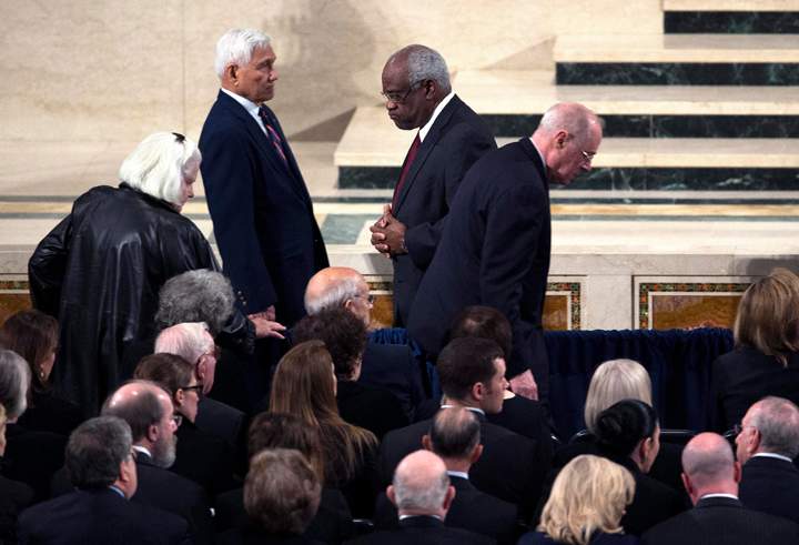 epa05172755 Justice Clarence Thomas, left, passes Justice Anthony M. Kennedy, following Holy Communion during the funeral Mass for Associate Justice Antonin Scalia at the Basilica of the National Shrine of the Immaculate Conception in Washington, DC, USA, 20 February 2016. US Supreme Court Justice Antonin Scalia was found dead at a resort ranch in Texas, 13 February, aged 79. EPA/DOUG MILLS / POOL