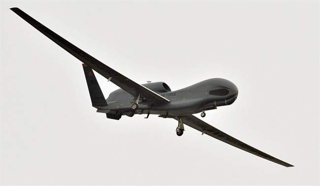 A U.S. Global Hawk surveillance drone prepares to land at the Misawa Air Base in Misawa, northern Japan, Saturday, May 24, 2014. 