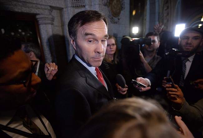 Finance Minister Bill Morneau speaks to reporters on Parliament Hill.